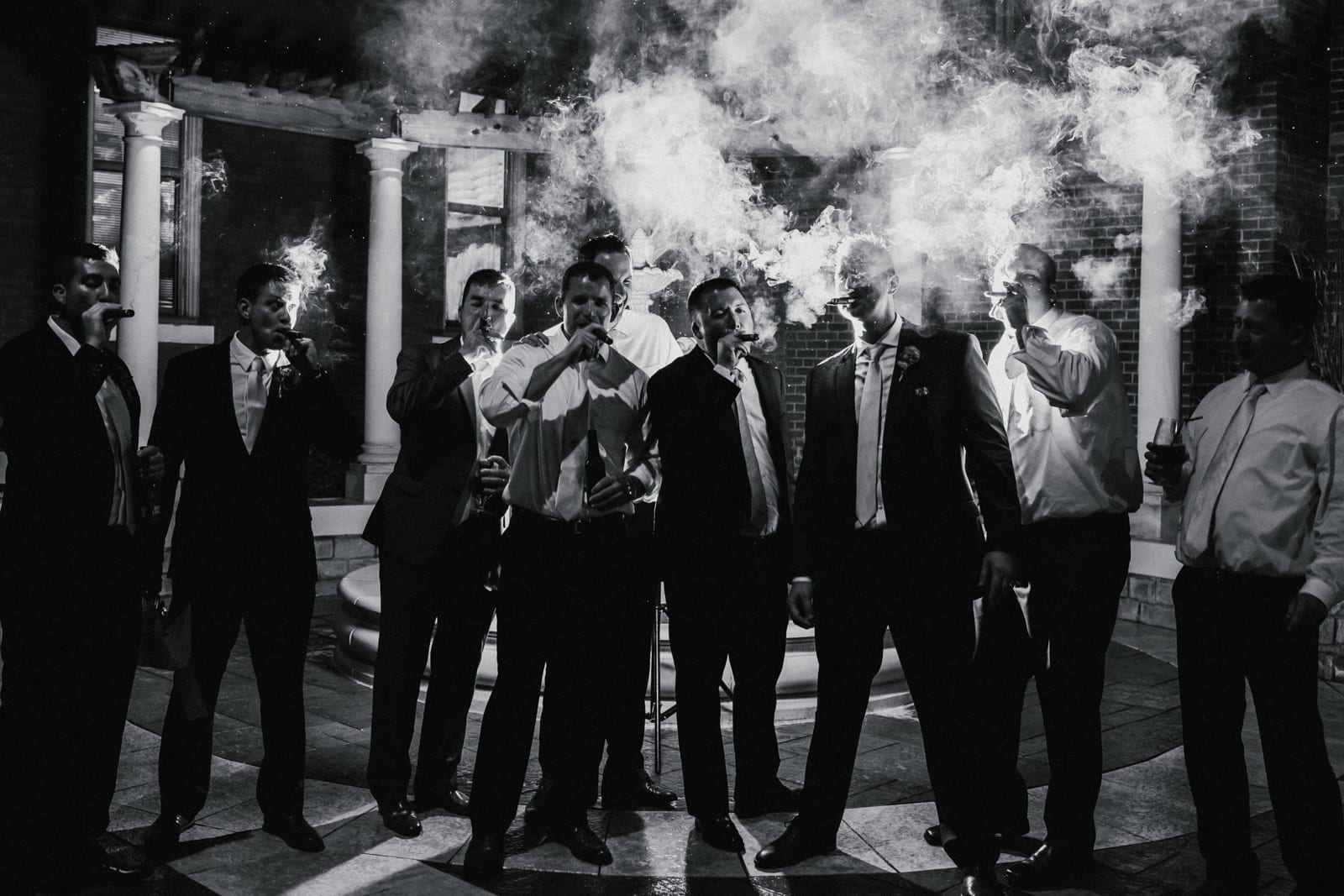 men smoking cigars at The Monastery Wedding - Cincinnati Wedding Photographer