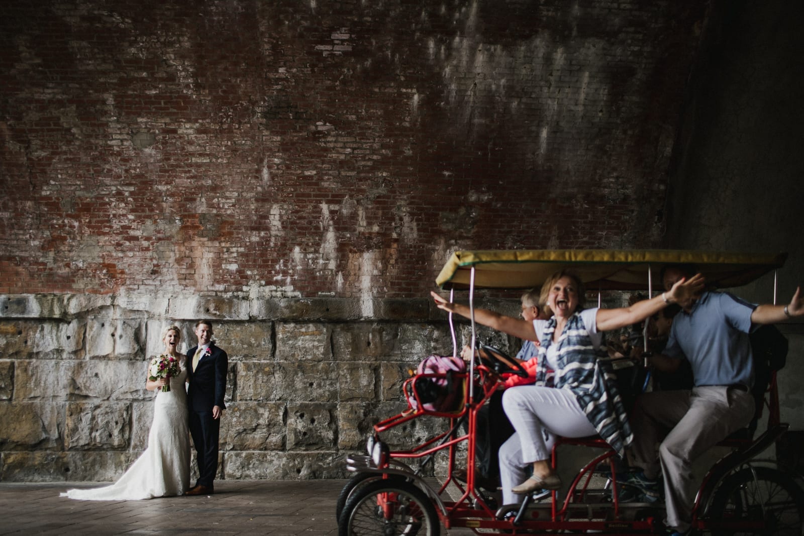 bride and groom laugh at photobombers at The Monastery Wedding - Cincinnati Wedding Photographer