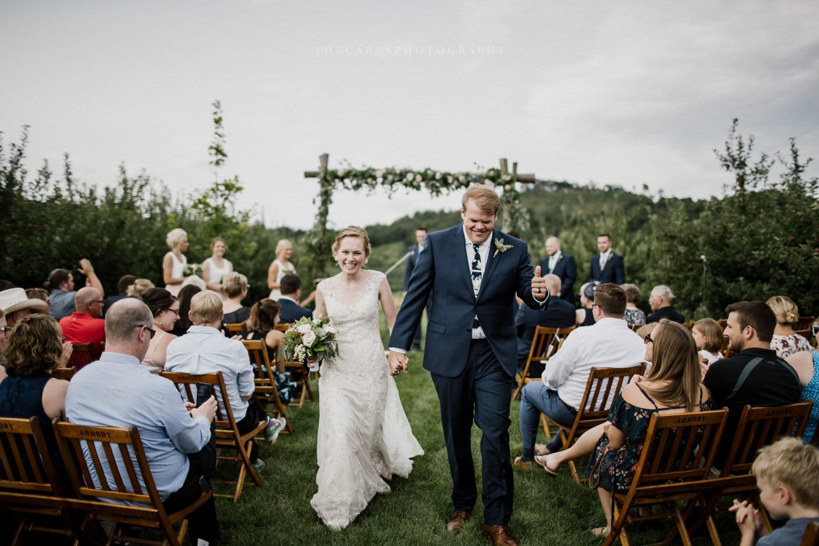 bride and groom leave ceremony at Eckers Apple Farm Wedding - Destination Photographer
