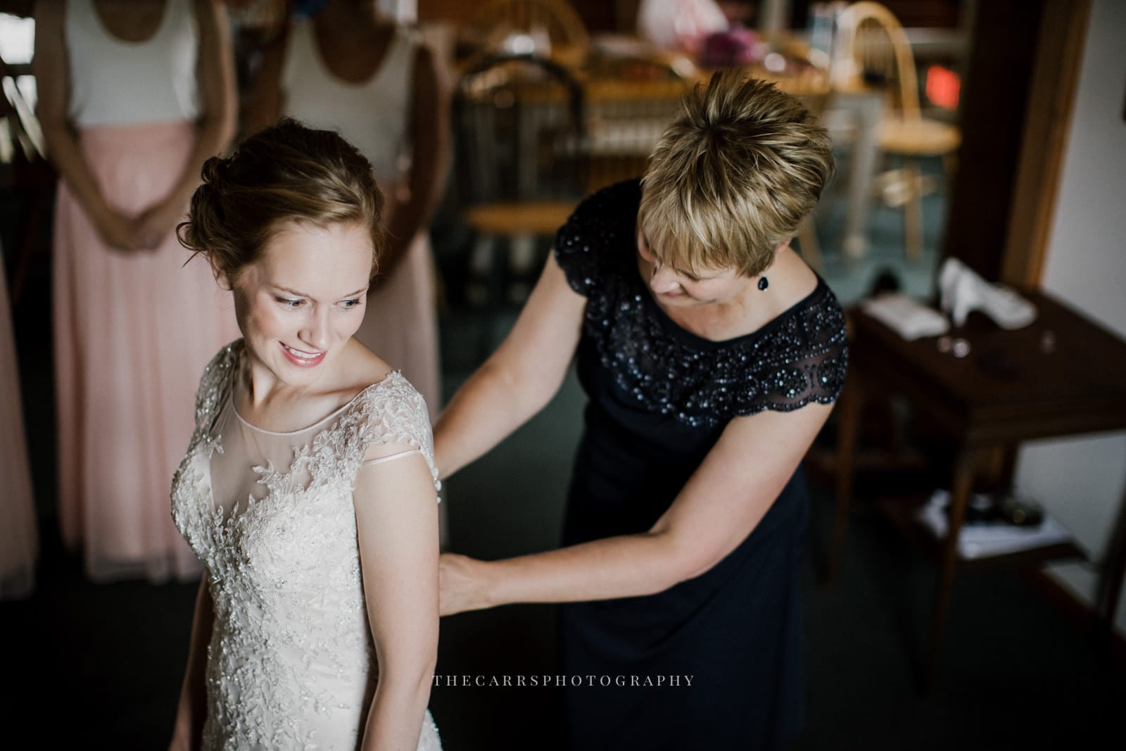 bride's dress getting buttoned at Eckers Apple Farm Wedding - Destination Photographer