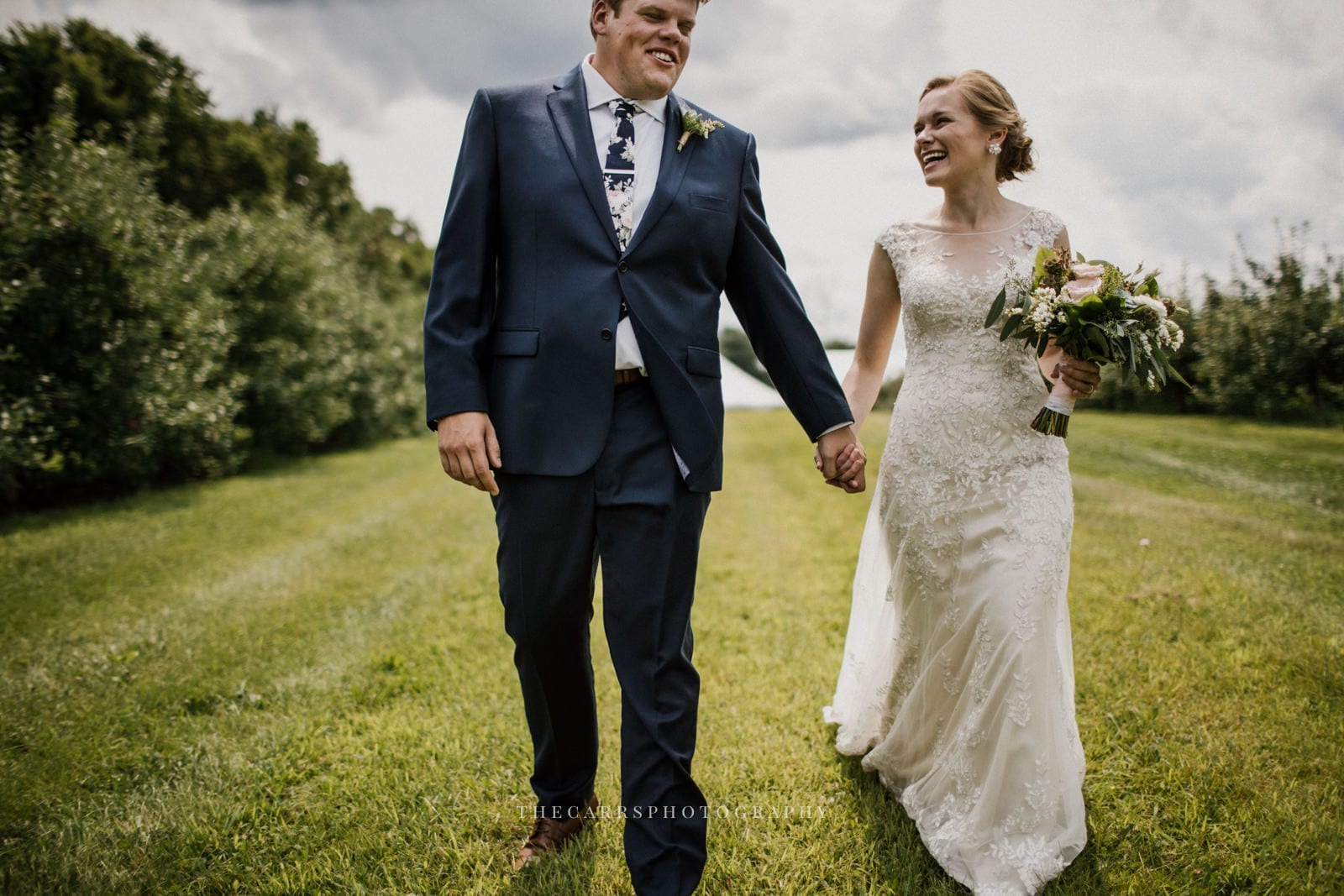 bride and groom holding hands at Eckers Apple Farm Wedding - Destination Photographer