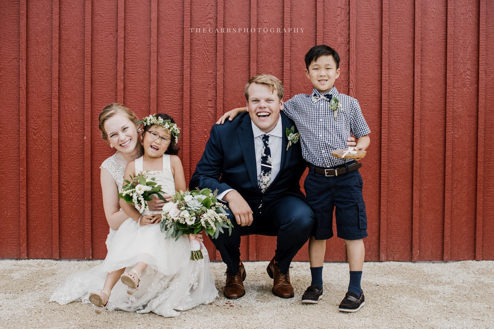 bride and groom with ring bearer and flower girl at Eckers Apple Farm Wedding - Destination Photographer