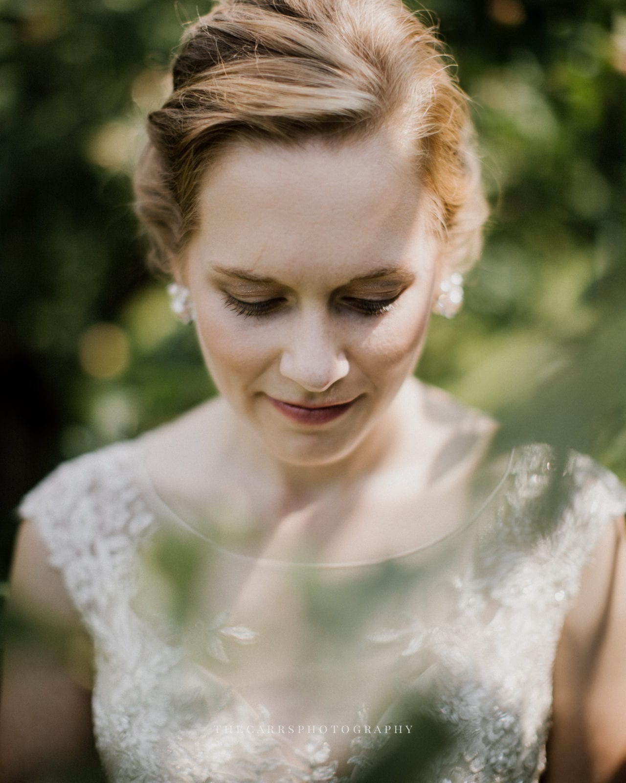 bride looking down at Eckers Apple Farm Wedding - Destination Photographer