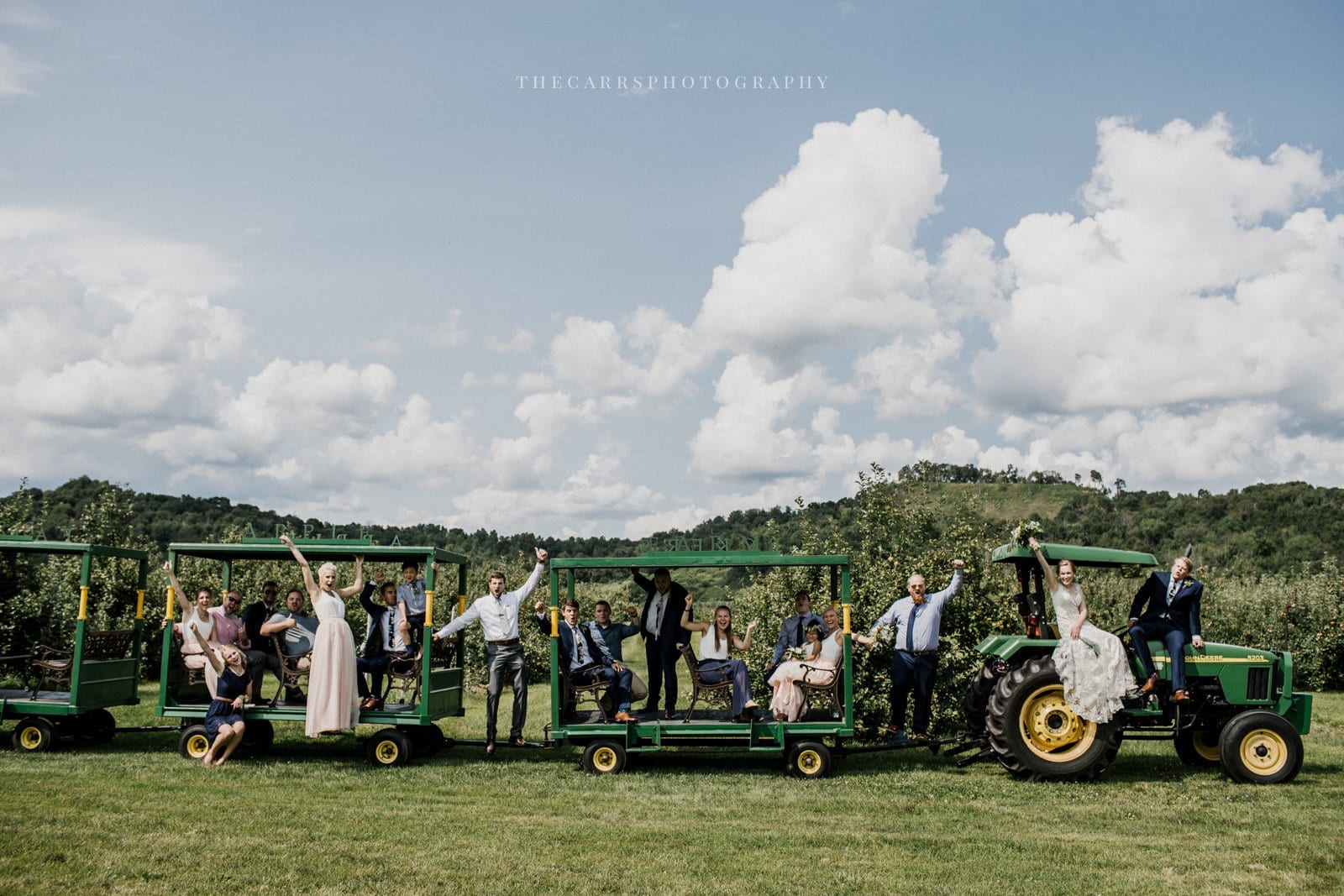 bride and groom and bridal party with tractor at Eckers Apple Farm Wedding - Destination Photographer