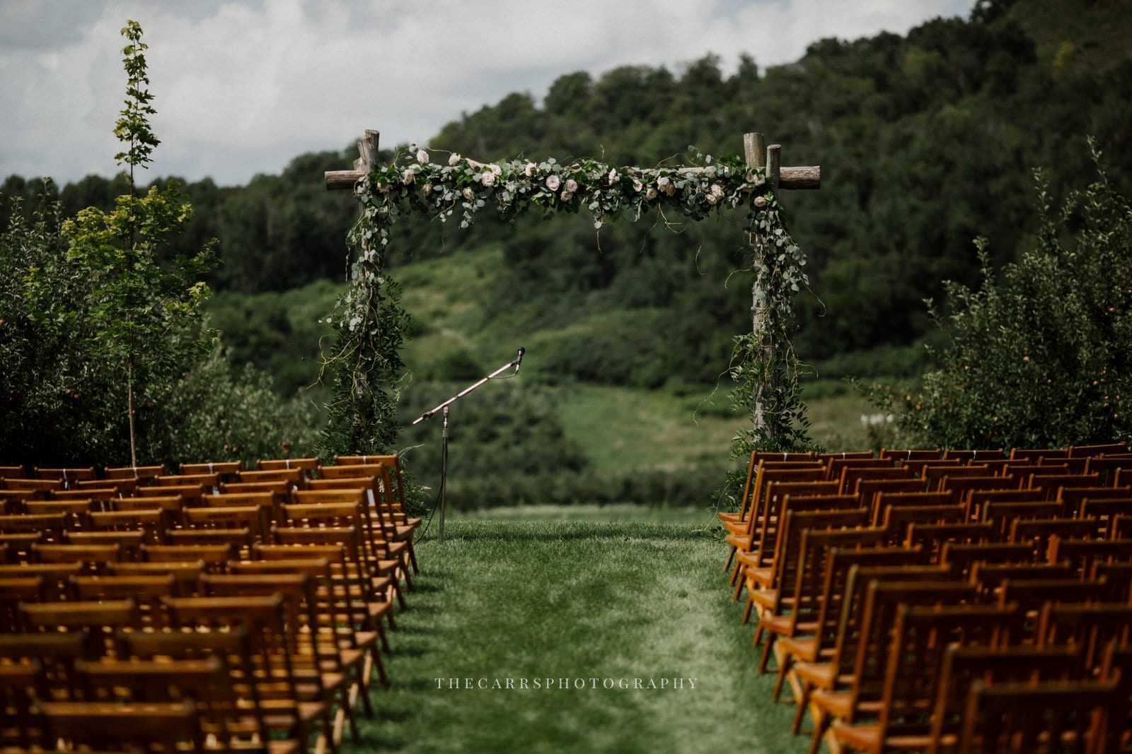 ceremony chairs and arch at Eckers Apple Farm Wedding - Destination Photographer