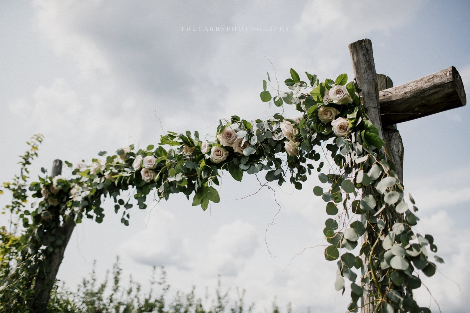 up close of ceremony arch at Eckers Apple Farm Wedding - Destination Photographer
