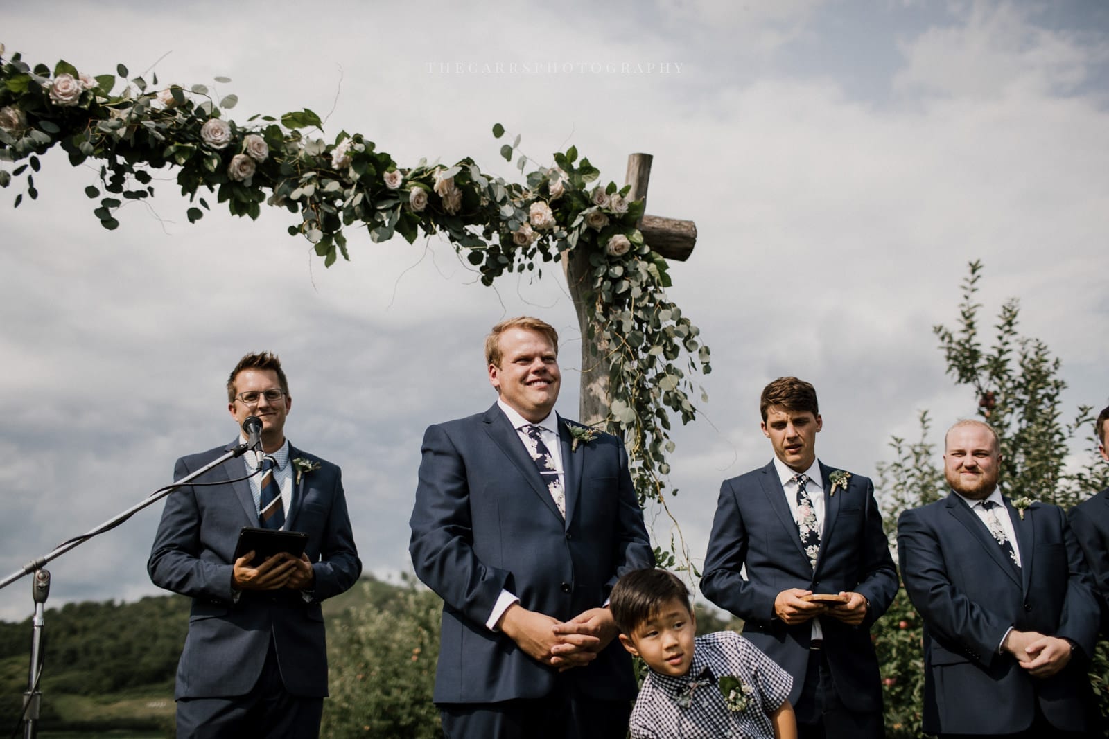 groom waits on bride down the aisle at Eckers Apple Farm Wedding - Destination Photographer