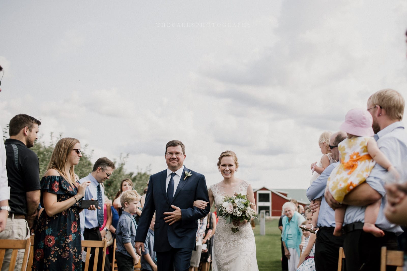 father walks bride down the aisle at Eckers Apple Farm Wedding - Destination Photographer