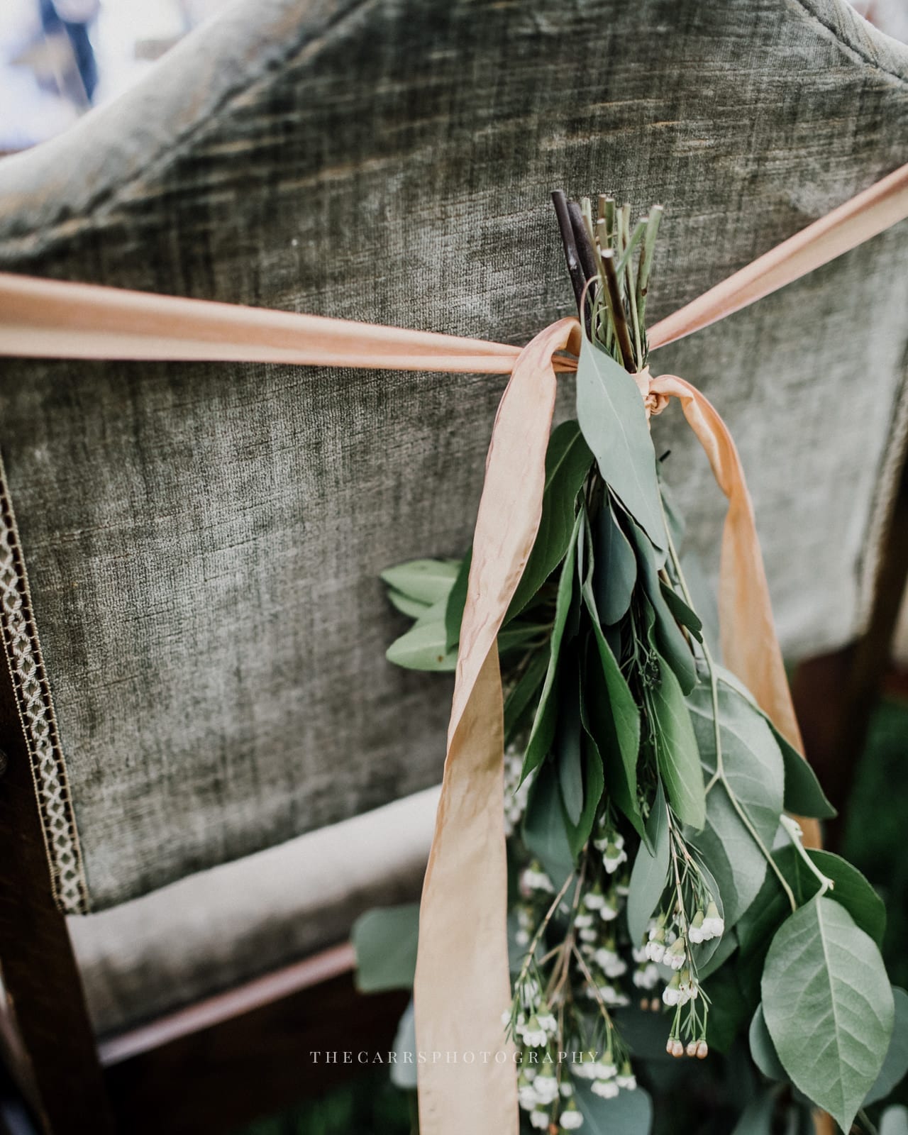 greens tied behind chair at Eckers Apple Farm Wedding - Destination Photographer