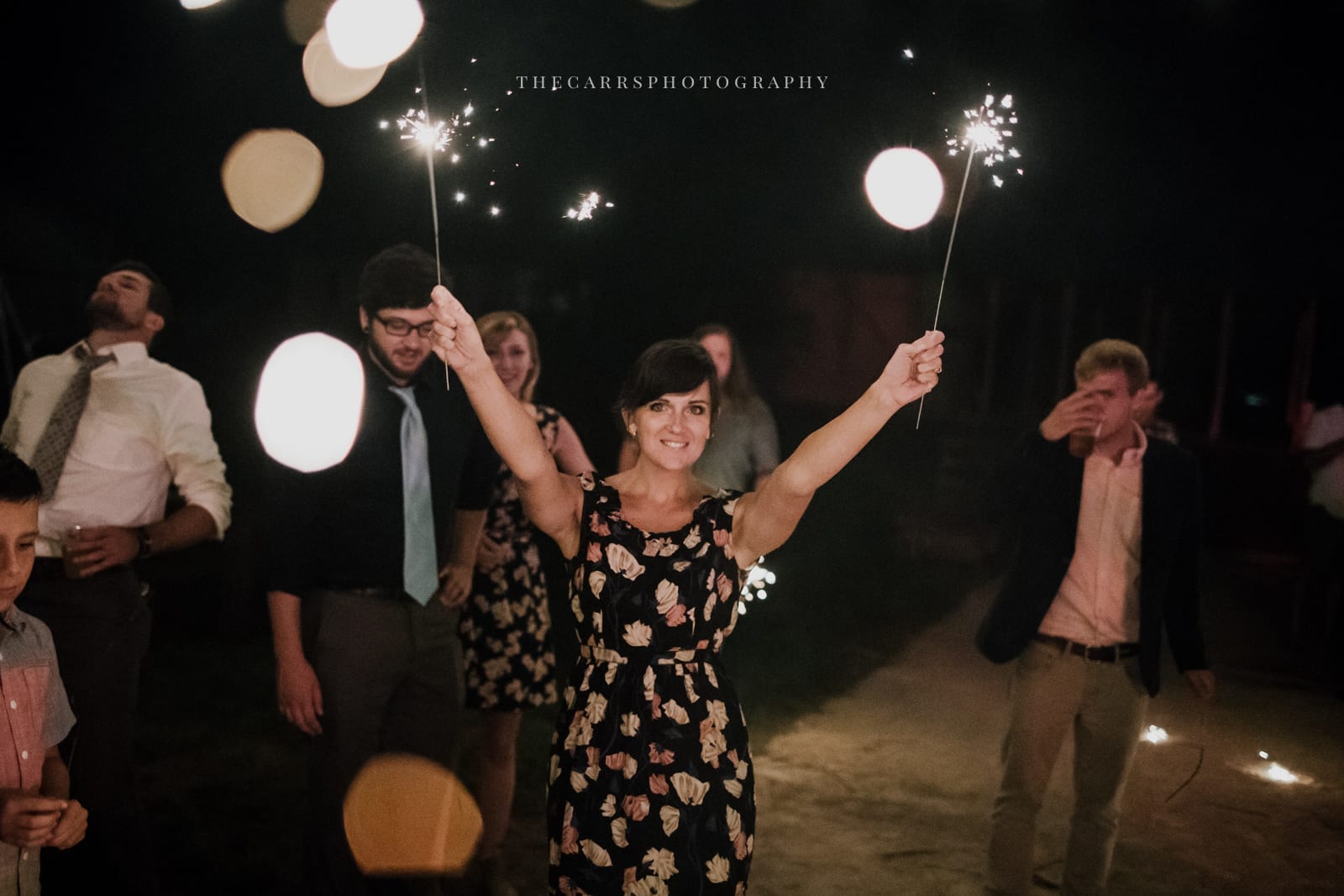 guest holding sparklers at Eckers Apple Farm Wedding - Destination Photographer
