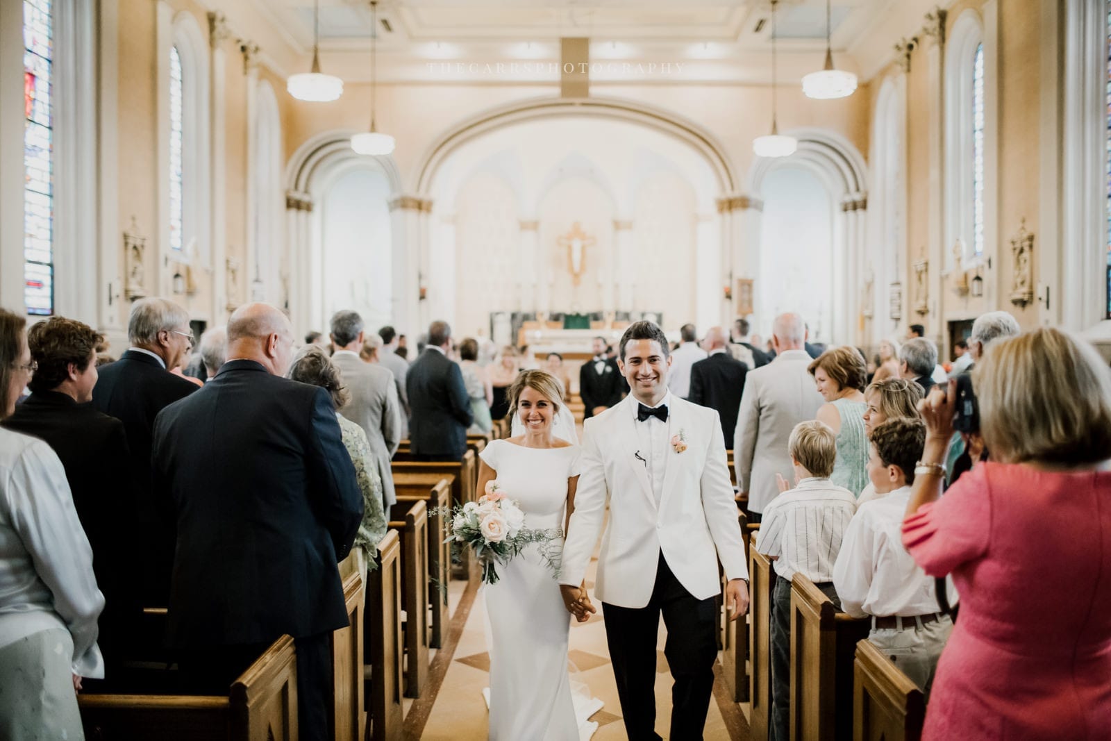 bride and groom walk up the aisle at lake house wedding - Akron Ohio Wedding Photographer