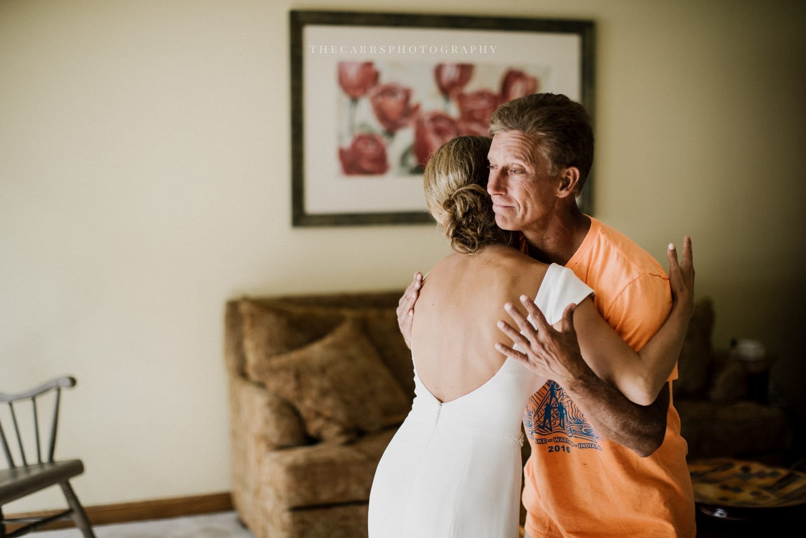 bride hugs dad at lake house wedding - Akron Ohio Wedding Photographer