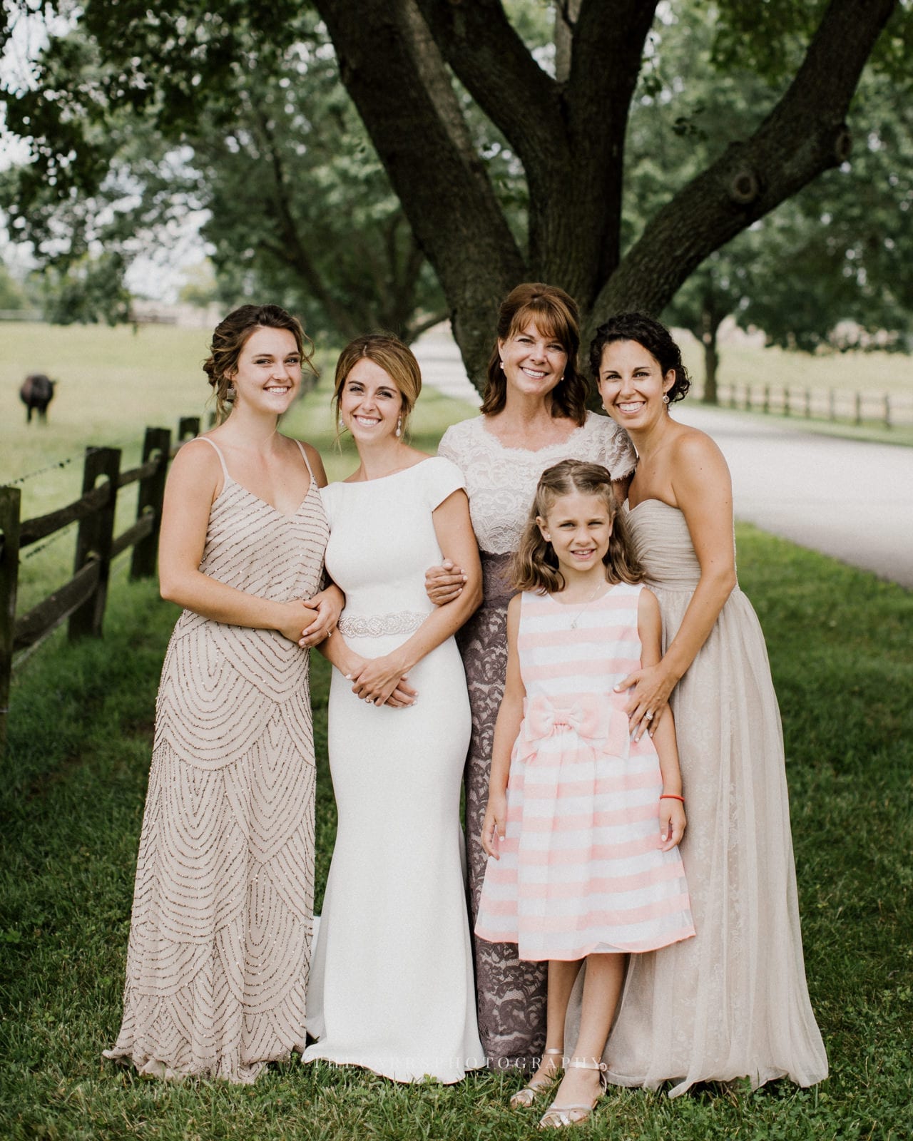 bride smiling with guests at lake house wedding - Akron Ohio Wedding Photographer