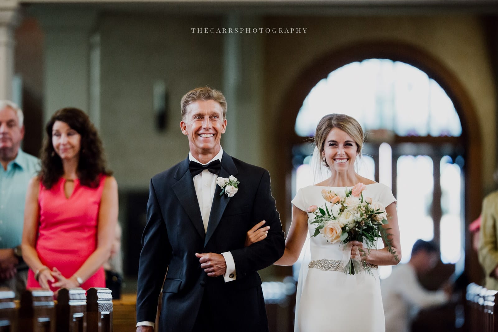 bride walks down the aisle at lake house wedding - Akron Ohio Wedding Photographer