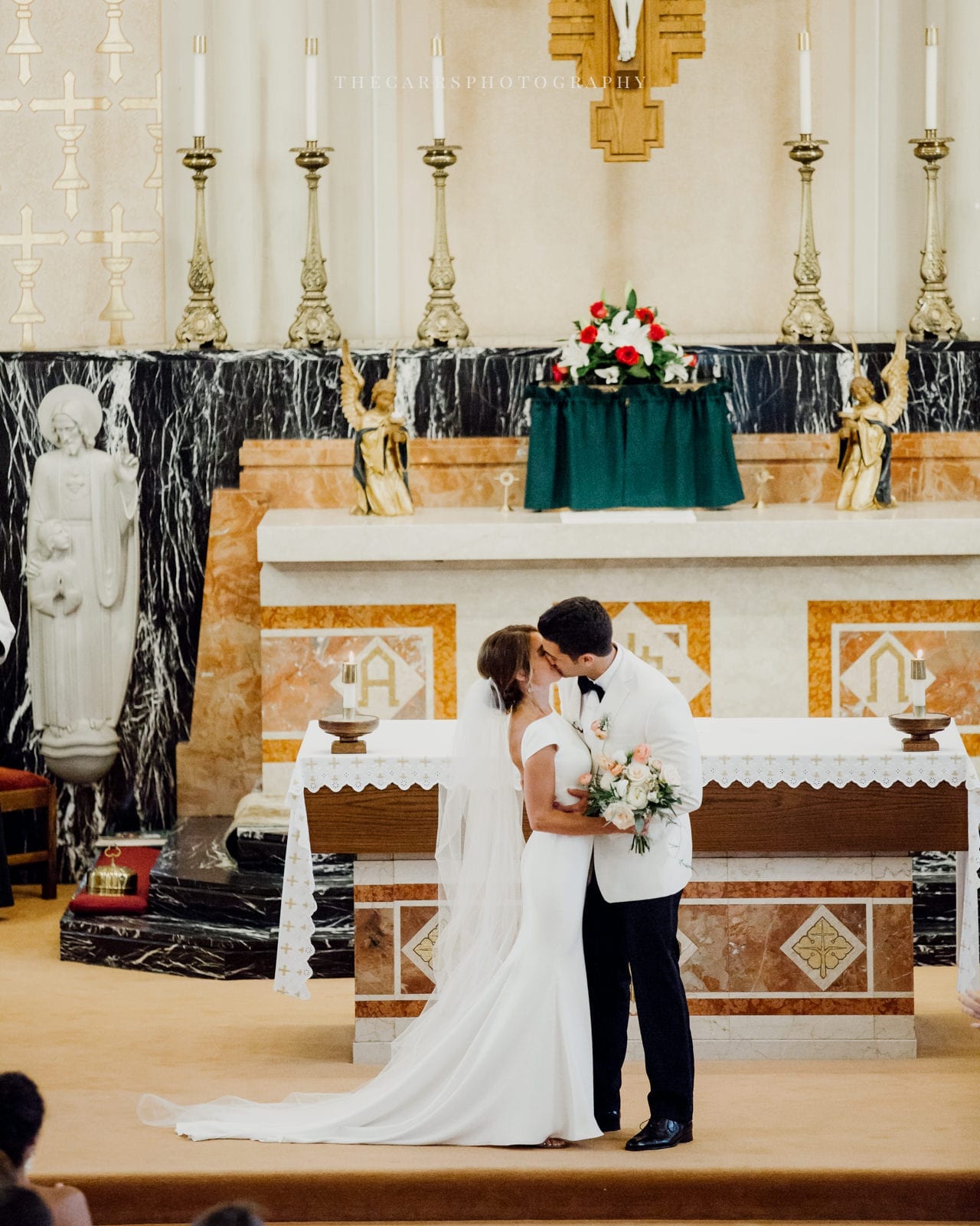 bride and groom first kiss at lake house wedding - Akron Ohio Wedding Photographer