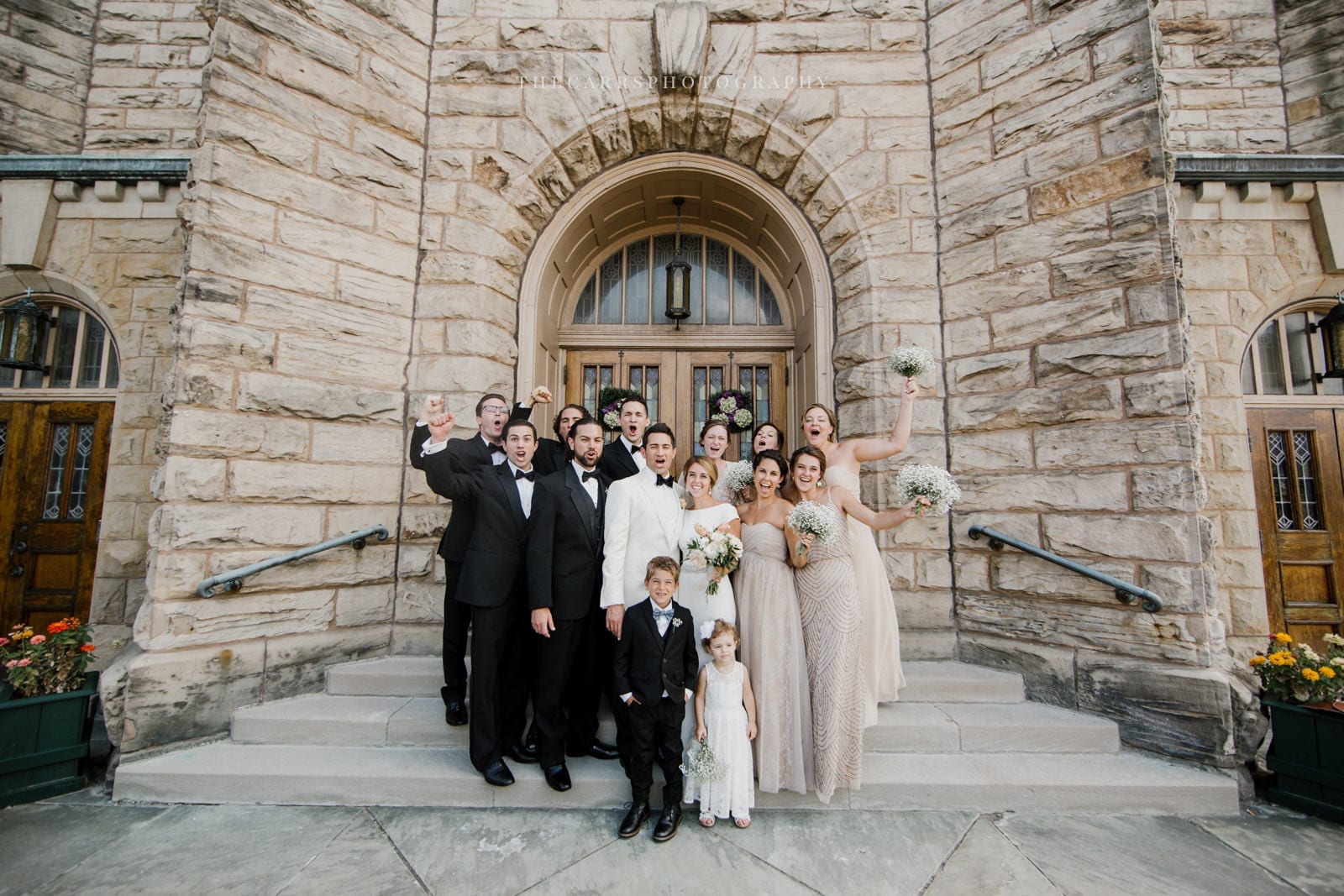 bride groom and bridal party at church doors at lake house wedding - Akron Ohio Wedding Photographer