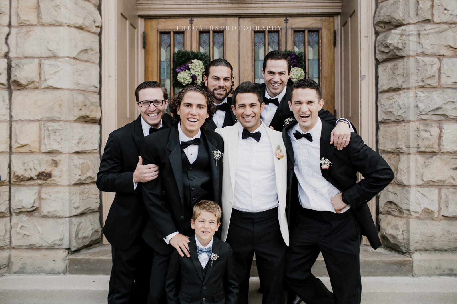 groom and groomsmen at church doors at lake house wedding - Akron Ohio Wedding Photographer