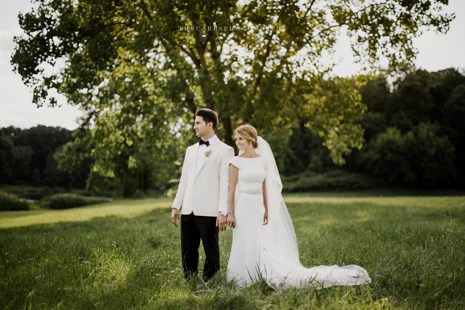 bride and groom smiling at lake house wedding - Akron Ohio Wedding Photographer