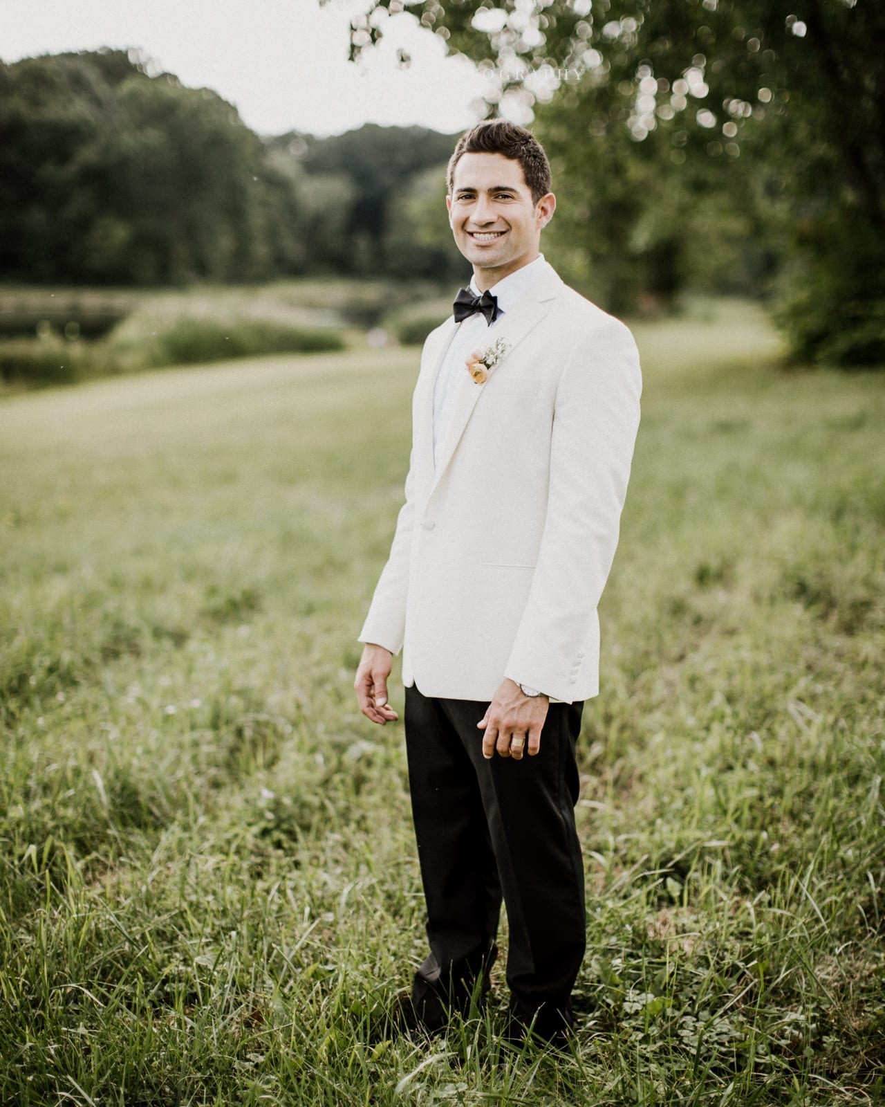 groom smiling at lake house wedding - Akron Ohio Wedding Photographer