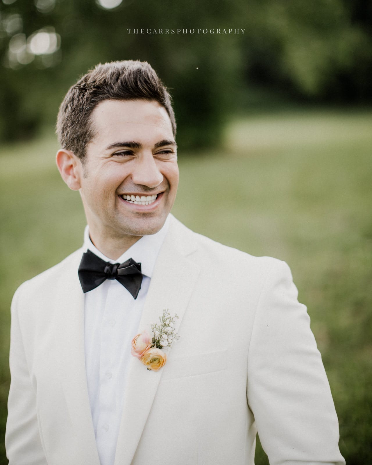 groom laughing at lake house wedding - Akron Ohio Wedding Photographer