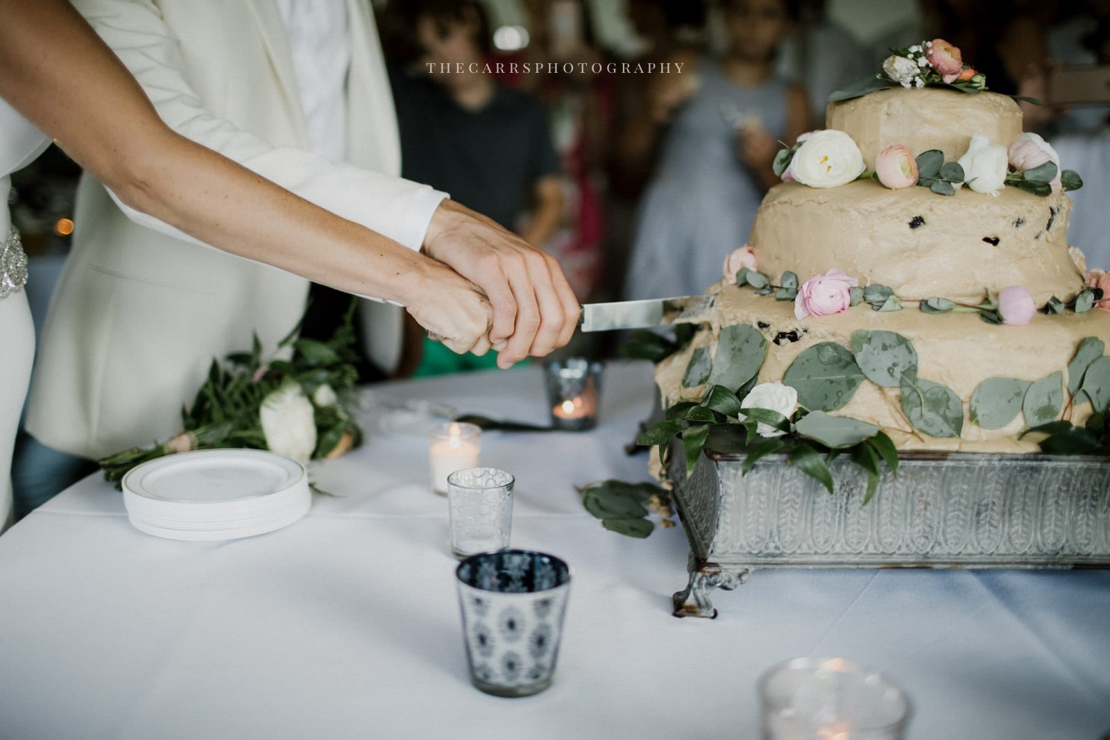 bride and groom cutting cake at lake house wedding - Akron Ohio Wedding Photographer