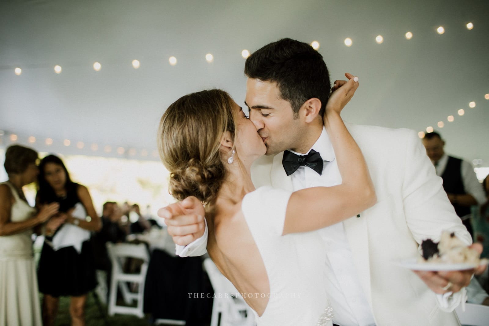 bride and groom kiss at lake house wedding - Akron Ohio Wedding Photographer