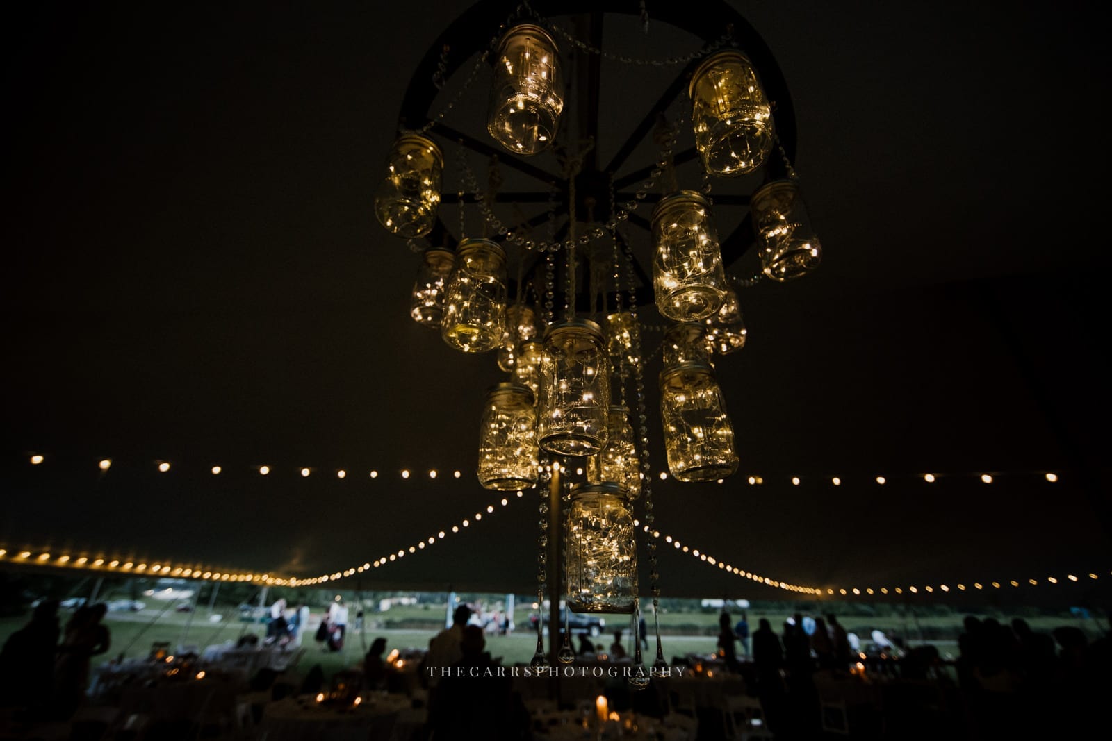 chandelier in tent at lake house wedding - Akron Ohio Wedding Photographer