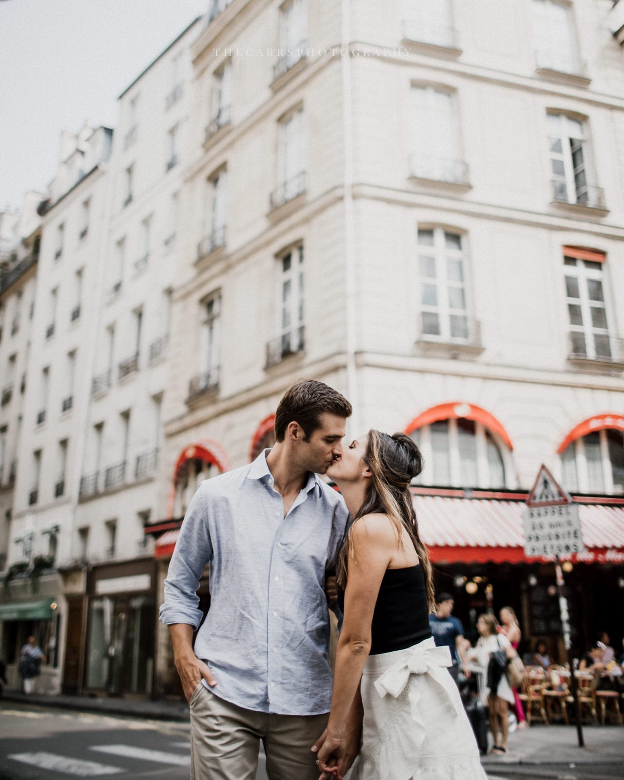 couple kisses in Persian Street by Paris Engagement Photographer