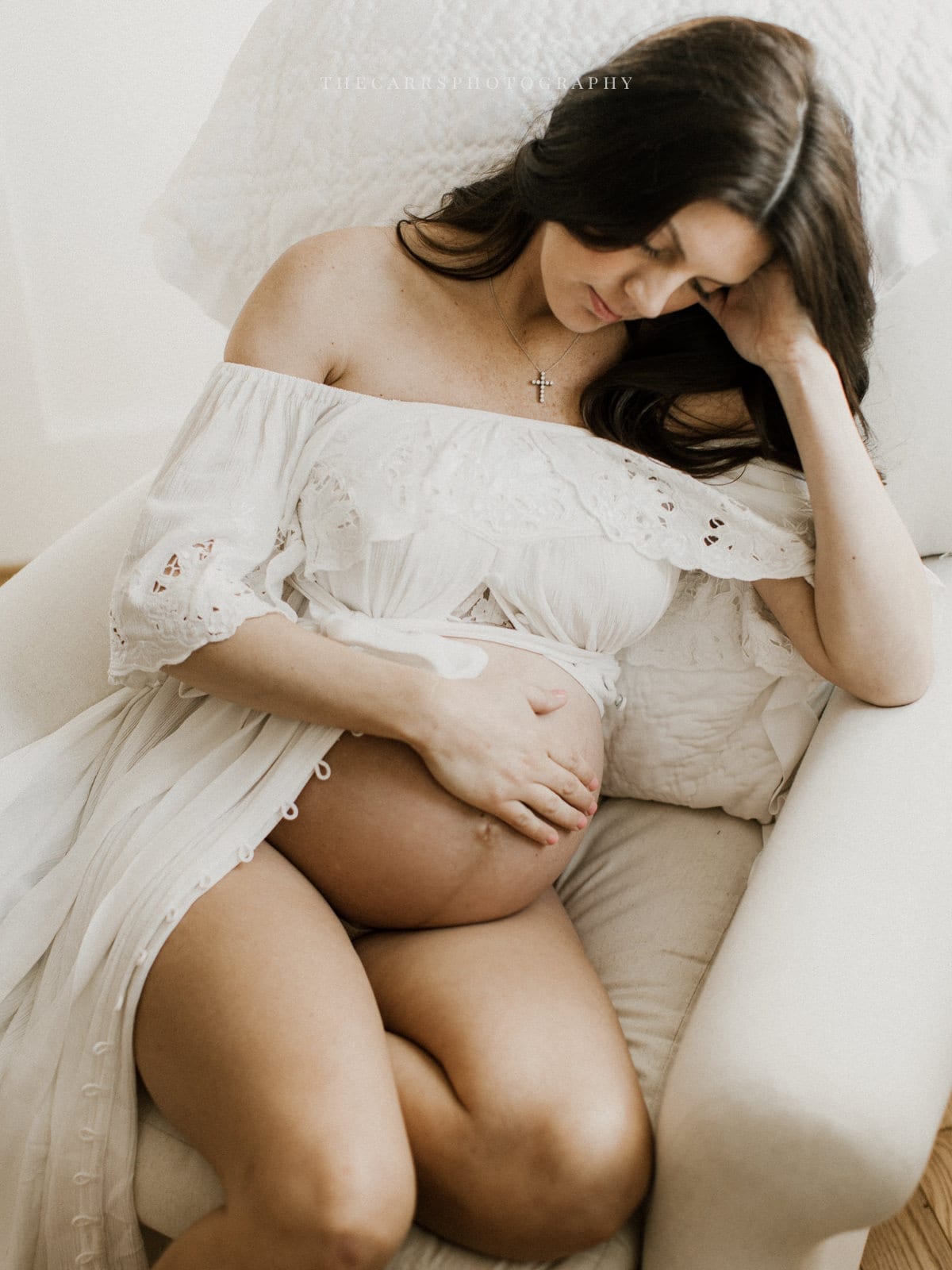woman sits in nursery - dayton ohio maternity photographer