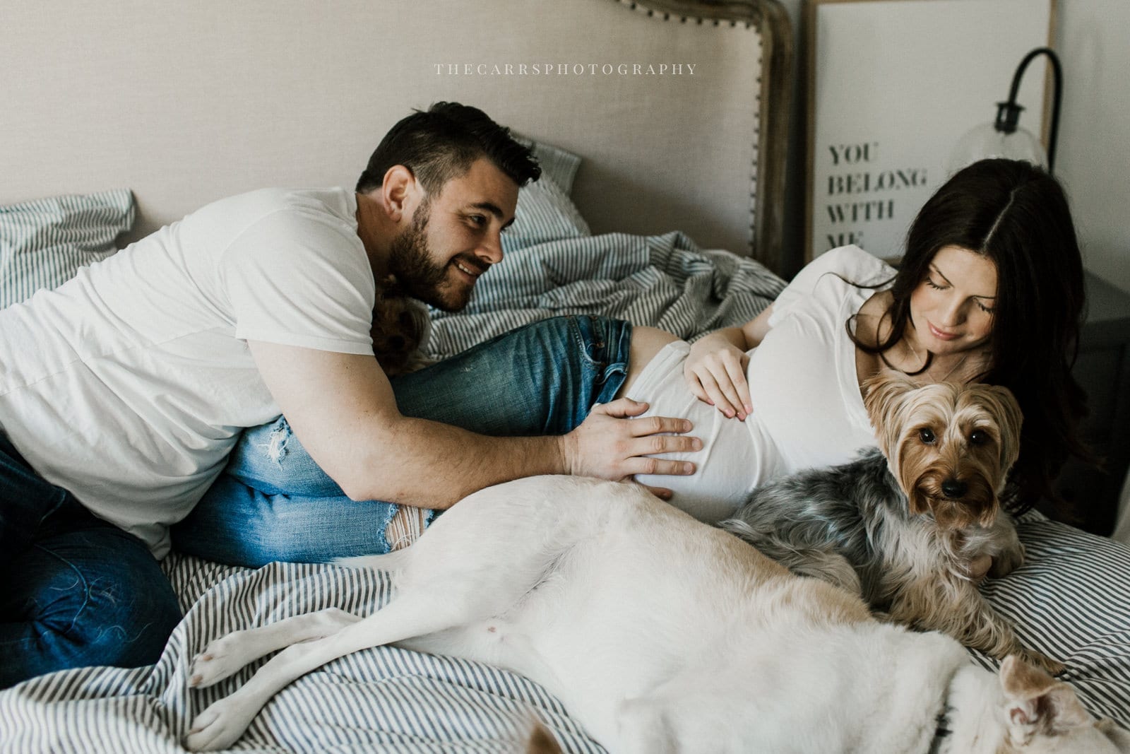 husband puts hand on wife belly - dayton ohio maternity photographer