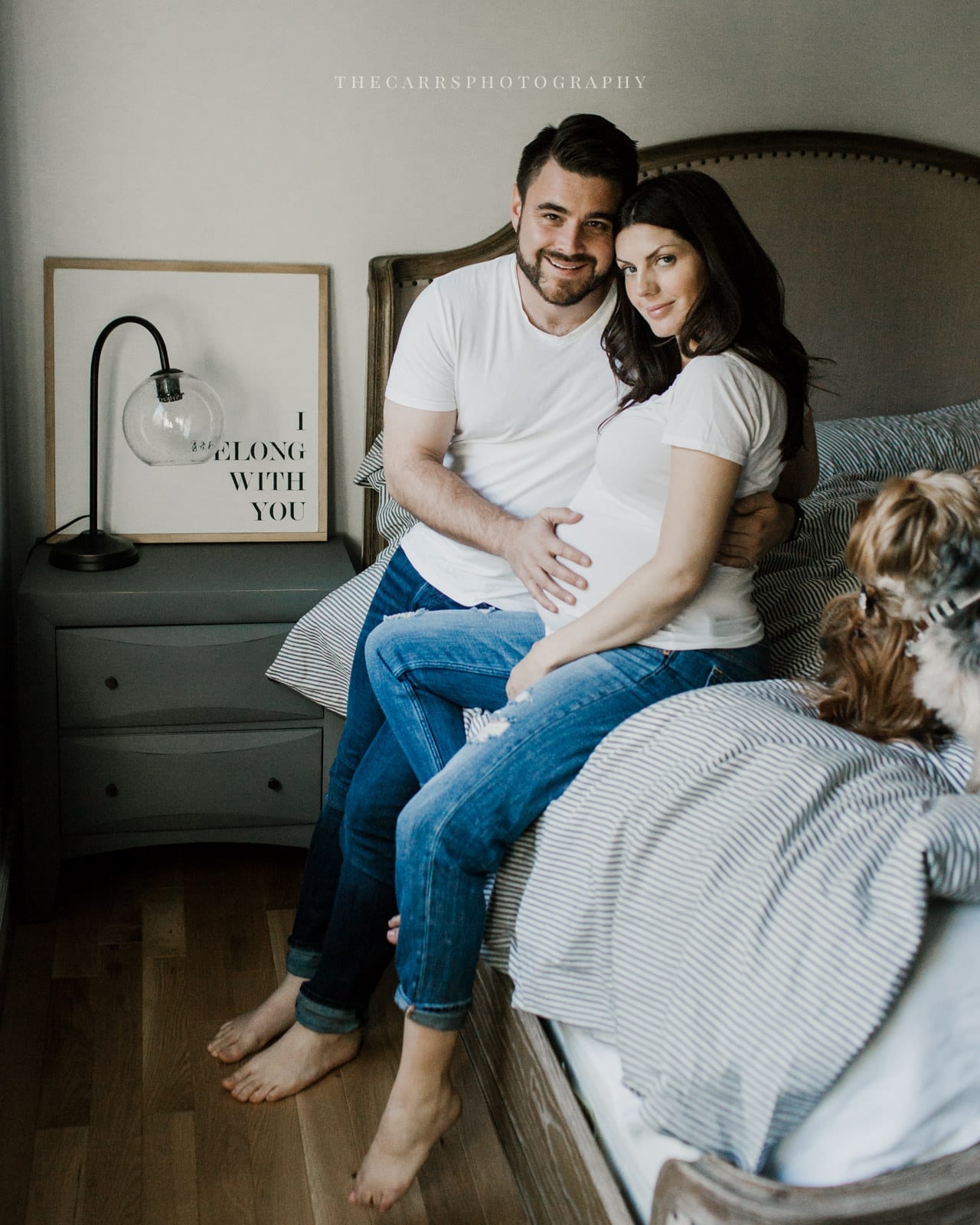 husband and wife sitting on bed - dayton ohio maternity photographer
