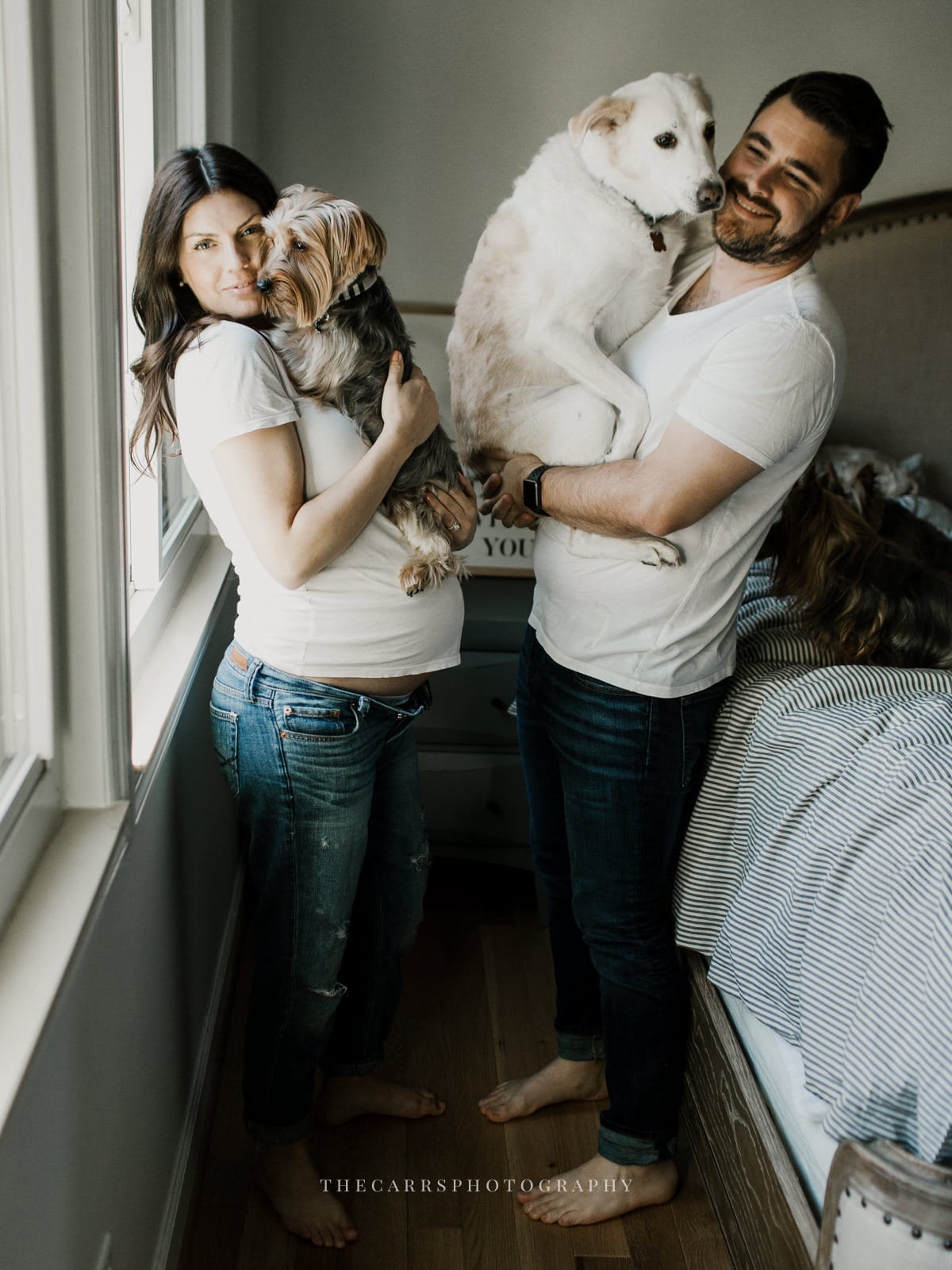 husband and wife holding dog - dayton ohio maternity photographer