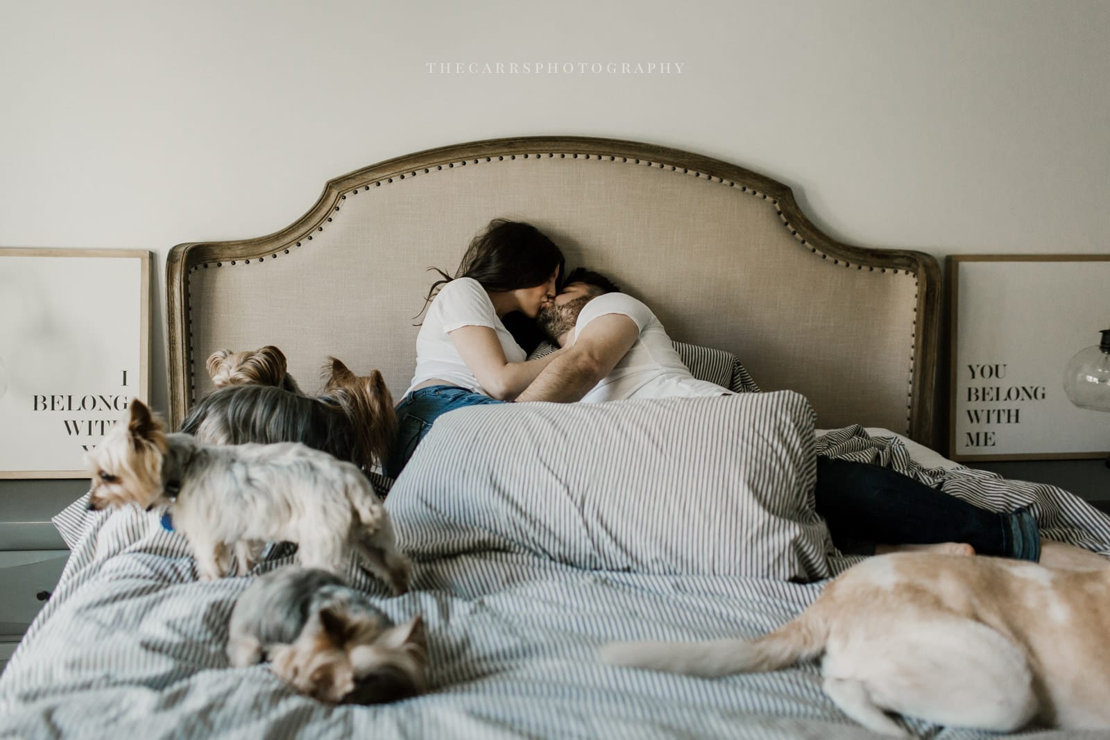 husband wife and dog laying on bed - dayton ohio maternity photographer