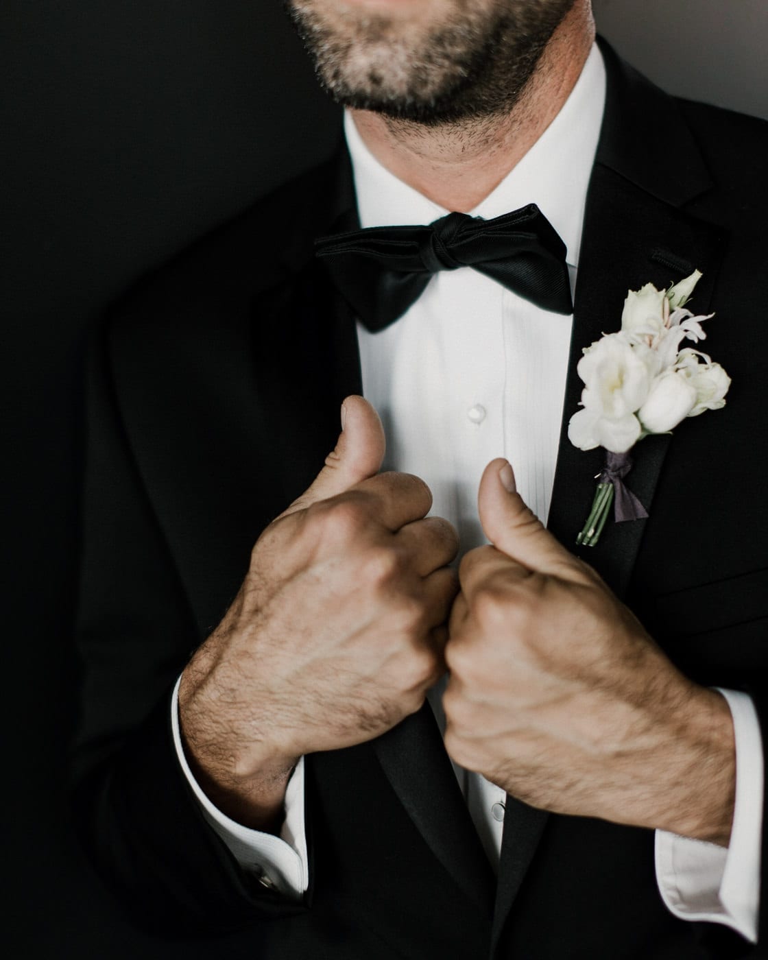 close up shot of grooms bowtie and boutonniere at Juniper Rooftop Wedding