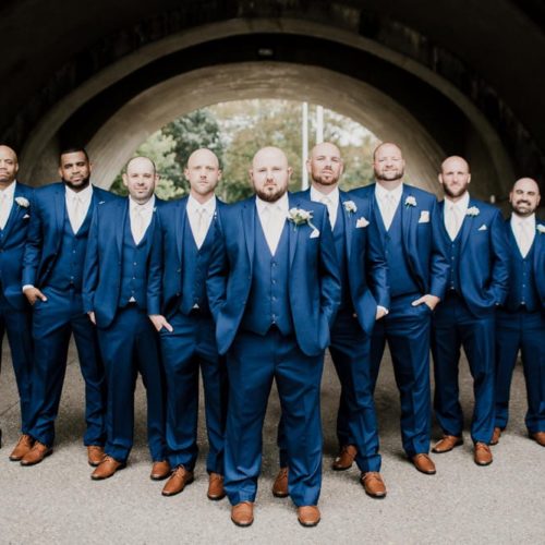groom and groomsmen standing in tunnel by Dayton Ohio Photographer Kera Estep