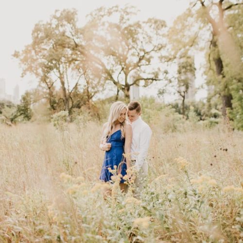 couple holding hands in field by Dayton Ohio Photographer Kera Estep