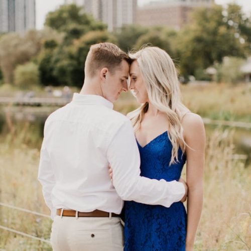 couple embracing with city in background by Dayton Ohio Photographer Kera Estep