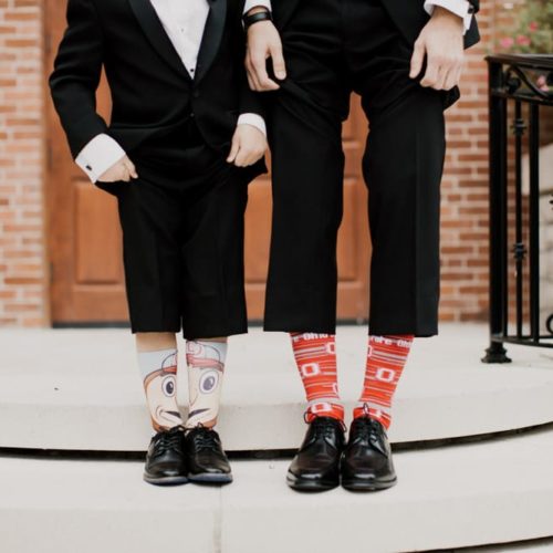 groom showing off socks by Dayton Ohio Photographer Kera Estep