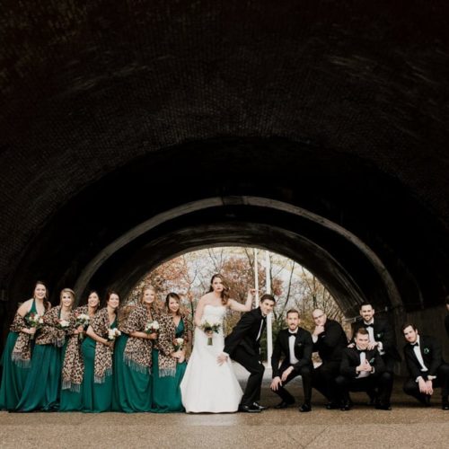 Bridal Party poses under a bridge in Cincinnati by Dayton Ohio Photographer Kera Estep