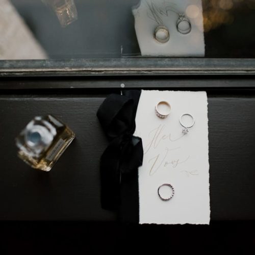 Rings, wedding vows, and perfume on a nightstand by Dayton Ohio Photographer Kera Estep
