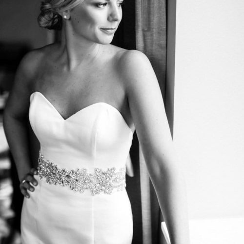 Bride in Wedding Dress Looks out of window by Dayton Ohio Photographer Kera Estep