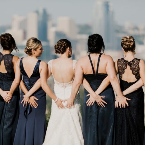 bride and bridesmaids grasping for hands by Dayton Ohio Photographer Kera Estep
