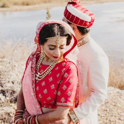 bride and groom in traditional Indian wedding attire by Dayton Ohio Photographer Kera Estep