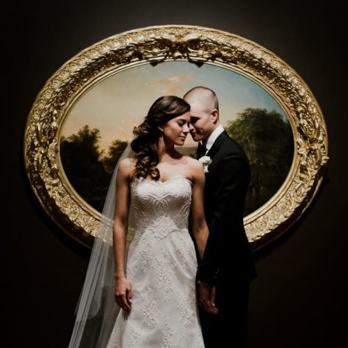 bride and groom in front of artwork by Dayton Ohio Photographer Kera Estep