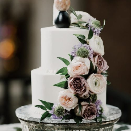 close up of wedding cake with flowers cascading by Dayton Ohio Photographer Kera Estep