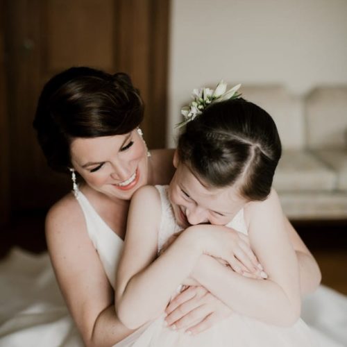 bride laughs with flower girl by Dayton Ohio Photographer Kera Estep
