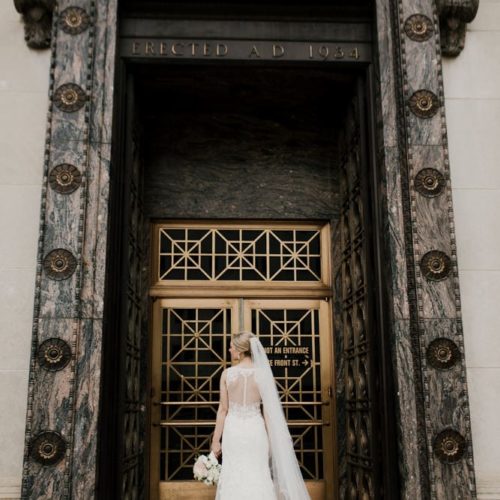 back of brides dress in front of ornate door by Dayton Ohio Photographer Kera Estep