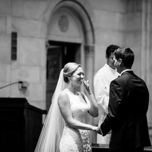 bride smiles at groom during ceremony by Dayton Ohio Photographer Kera Estep