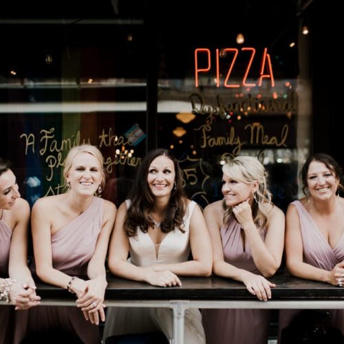 bride and bridesmaids outside pizza joint by Dayton Ohio Photographer Kera Estep