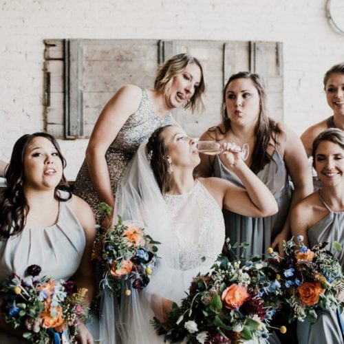 bride sips champagne with bridesmaids by Dayton Ohio Photographer Kera Estep